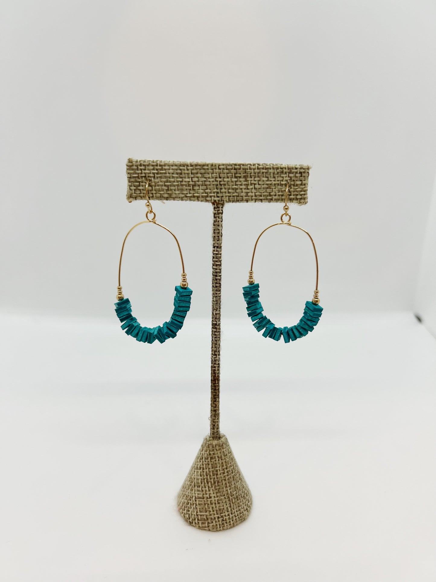 Gold Oval Earrings with Blue Accent